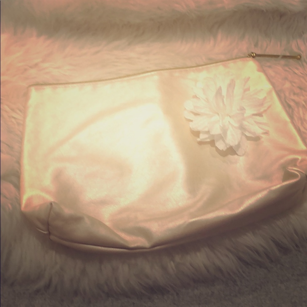 Clutch with floral accent